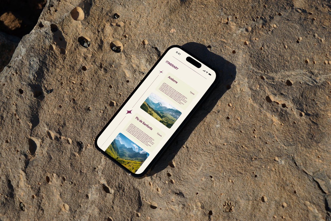 Active Trails app displayed on a smartphone resting on rock