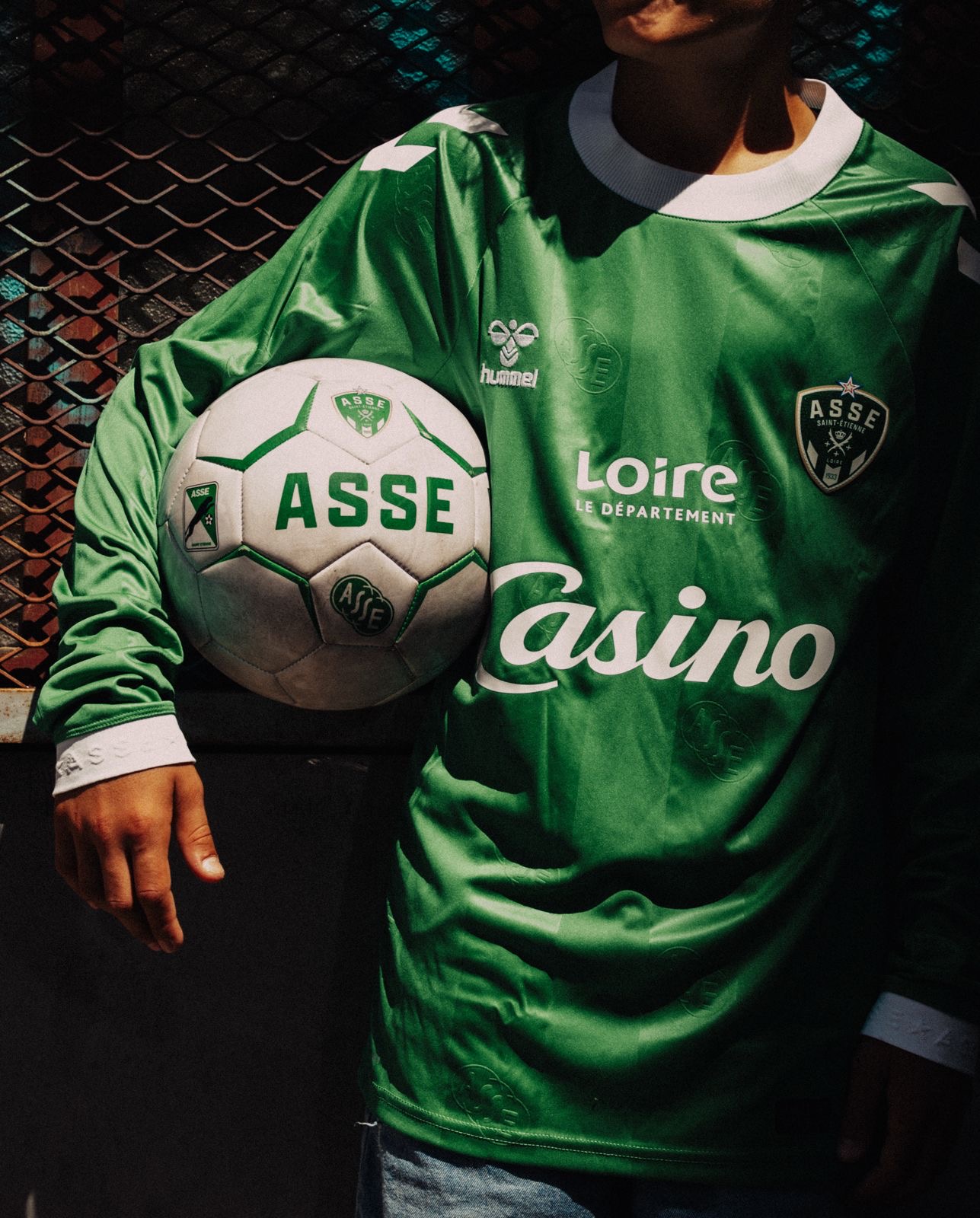 Detail of the jersey and ball bearing the ASSE crest