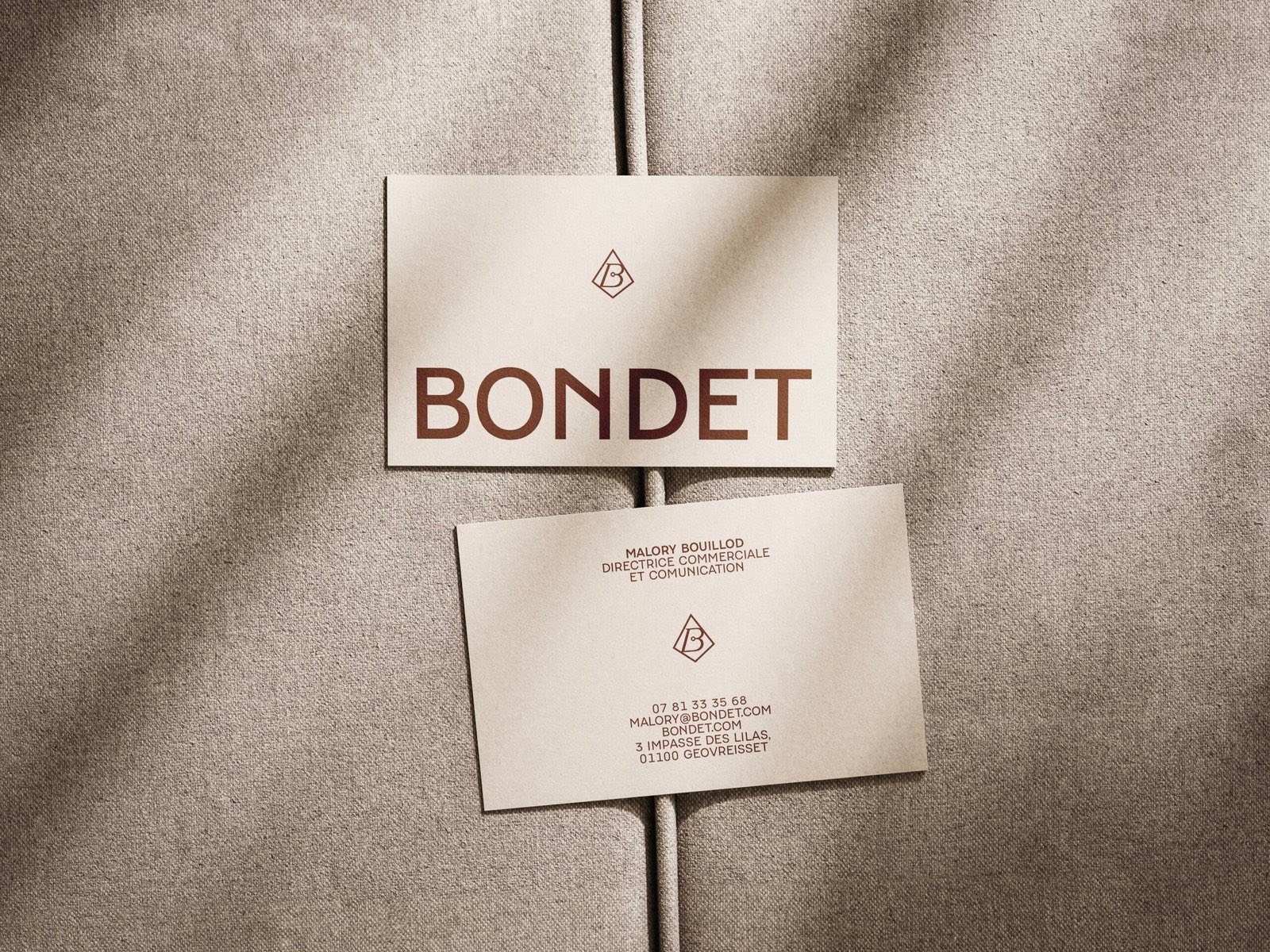 Bondet business cards on a textile background